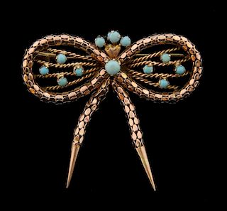 Turquoise and gold bow brooch, 14 ct , 4 x 4.5 cm