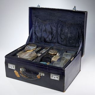 Vintage leather travel case with silver vanity set