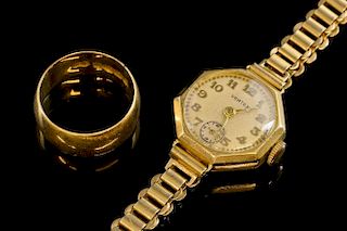 Gold wedding band, 18 ct, and a lady's gold watch on bracelet strap, 9 ct