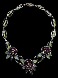 A fine enamel and gemset flower necklace, ruby set flowers with a diamond to the centre, green Plique--jour leaves mounted