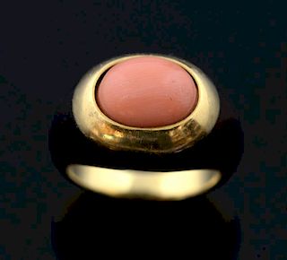 Boucheron tortoiseshell and coral dress ring, angle skin cabochon cut coral to the centre. French. Signed Boucheron. Mounted 