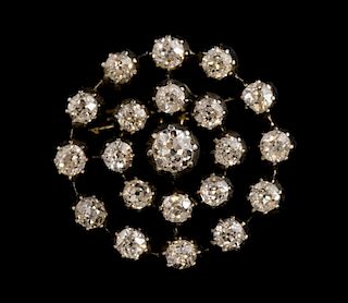 Late Victorian diamond cluster brooch, set with old cut diamonds in three tiers mounted in silver and gold. Diameter 2.7 cm.T