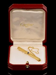 Cartier tie pin set with cabochon sapphire, with safety chain, signed Cartier dated 1991, 750 for 18 ct gold and numbered D54