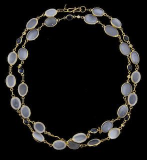 Contemporary  gold necklace of oval cabochon moonstones and faceted round sapphires, set in 18 ct gold