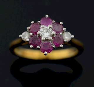 Ruby and diamond cluster ring mounted in 18ct yellow gold.