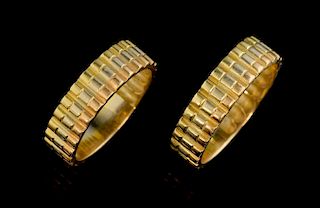 A pair of wedding bands, three colour gold with ribbed surface, unmarked yellow metal