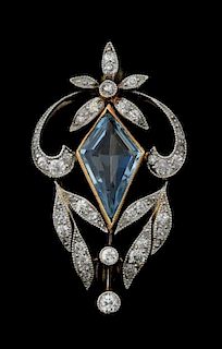 An Art Deco Aquamarine and diamond brooch, set with a lozenge shape aquamarine with a surround of old cut diamond in a milleg