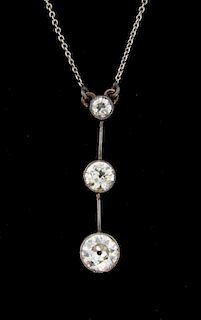 Edwardian diamond drop pendant, set with three old diamonds with a knife edge bar suspending each diamond, approximately 0.60