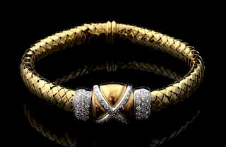Gold and diamond bracelet, the centre with a stylised diamond set cross and pave set diamond shoulders to  gold woven style l