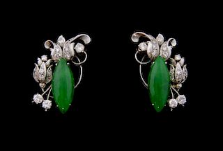 Jade and diamond earrings, in the form of a flower with a marquise shape jade  and diamonds to the sides mounted in side set 