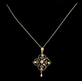 Edwardian gold and opal open work pendant, 15 ct, on gold chain 9 ct .
