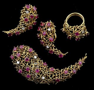 Suite of gold and ruby modernist jewellery. including a abstract brooch, ring and earring set tested as 18 ct. Circa 1960's
