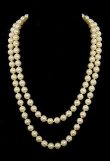 A single row of one hundred and seven cultured pearls measuring 7 mm , strung knotted. Length With original receipt from Harr