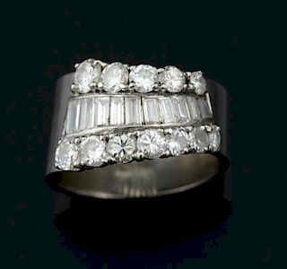 Contemporary diamond set dress ring, curve setting with baguette and brilliant cut diamonds  in 18 ct white gold