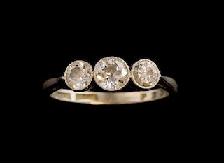 Three stone diamond ring  in milgrain setting, central stone 0.30 carat, total diamond weight approximately 0.60 carat, 18 ct