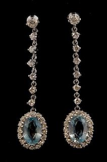 A pair of white gold aquamarine and diamond drop earrings, stamped 18 ct, 4 cm