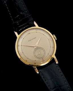 Jaeger LeCoultre, 18ct gold wristwatch the champagne dial with Arabic and dot numerals and seconds subsidiary at 6, the back 