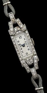 Lady's diamond set cocktail watch, watch case platinum, strap, base metal