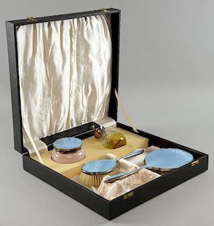 Blue guillouche enamel and white metal dressing table set, atomiser, powder jar, hair brush and mirror in original case.