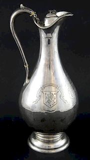 Victorian silver presentation claret jug and cover engraved with the arms and motto of the Royal Irish Regiment and inscribed