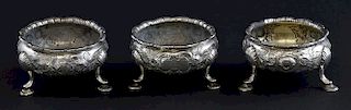 Matched set of three George III silver salts, with embossed decoration on three hoof feet, two by David Mowden, London, 1763,
