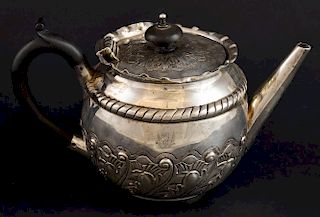 Victorian silver teapot with embossed decoration, by Charles Edwards, London, 1884, gross weight 8.1oz, 253g,