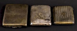 George V silver cigarette case with engine turned decoration, by Frederick Field Ltd., Birmingham, 1930, and two other cigare
