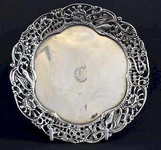 Victorian silver card tray, the pierced border with bird and figural decoration, on three scroll feet, by Henry Wilkinson & C