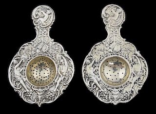 Pair of Victorian silver tea strainers with moulded decoration by Berthold Muller, import marks for Chester, 1898, 3.7oz, 118