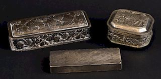 19th century Dutch silver box with embossed figural decoration, English silver box embossed with putti and a white metal engi