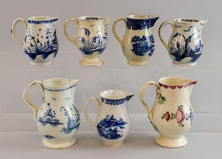 18th century English polychrome jug, 12 cms high and six other 18th century blue and white jugs