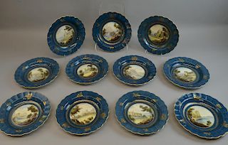 Royal Worcester rimmed bowls (11) signed C. Johnson, the centre painted with a landscape setting, title hand written on verso