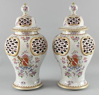A pair of Continental reticulated baluster vases and covers in the Chinese taste 43.5 cm