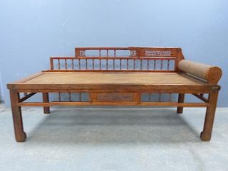 Chinese day bed with raised spindle back and rattan seat,
