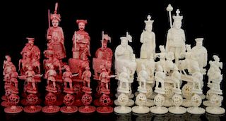 Early 20th century Cantonese ivory red and white chess set with elephant rooks and knights on horseback, all on puzzleball co
