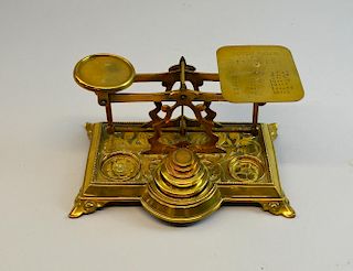 Early 20th century brass postal scales, 20cm wide