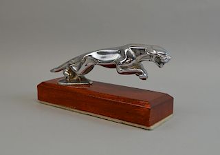 Silver plated jaguar car mascot, 21cm wide, on wooden base