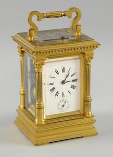 French gilt brass repeating carriage clock the case with fluted Corinthian columns, the eight day movement striking the hours