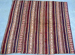 Persian design rug and a woven wall hanging,