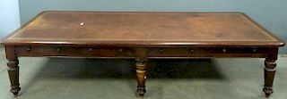 19th century mahogany double partners desk with four drawers to each side on turned legs and casters . 360cm x 128cm.