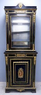 19th century ebonised cabinet, glazed door over cupboard door, gilt metal mounts, inset with painted panels,