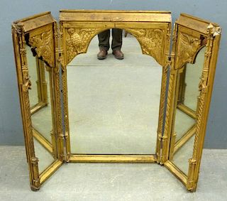 19th Century Gothic Revival carved giltwood triple mirror the frame carved with turrets and mythical creatures. 100cm x 121cm