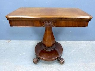 William IV mahogany fold-over card table on platform base with lions paw feet, 91cm x 46cm,