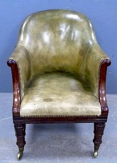 19th century mahogany framed and leather upholstered armchair on turned and carved supports,