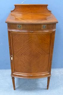 20th century Maple & Co., satinwood bow fronted cabinet, with a single drawer over a cupboard door on turned and carved taper