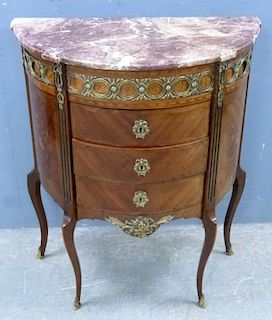 French mahogany, rosewood and marquetry inlaid demi-lune cabinet with gilt metal mounts, marble top over four central drawers