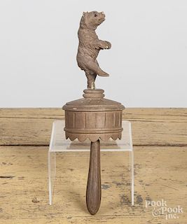 Black Forest carved dancing bear musical toy, early 20th c., the bear spins as the handle is turned