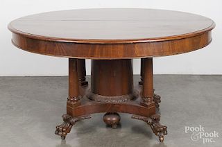 Empire mahogany extension dining table, 19th c., 29'' h., 53 1/2'' w., together with four 13'' leaves.