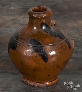 Miniature redware jug, 19th c., with manganese splotches, 3 1/2'' h. Provenance: Titus Geesey.