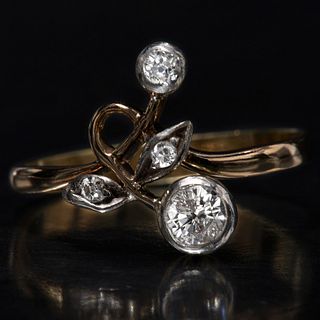 DIAMOND RING, of stylized floral design